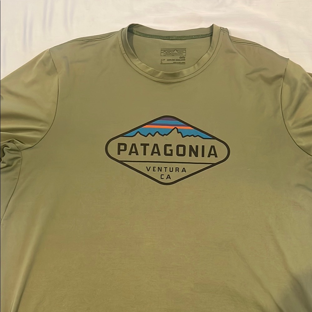 Patagonia Green short Sleeve capilene shirt with Classic Logo